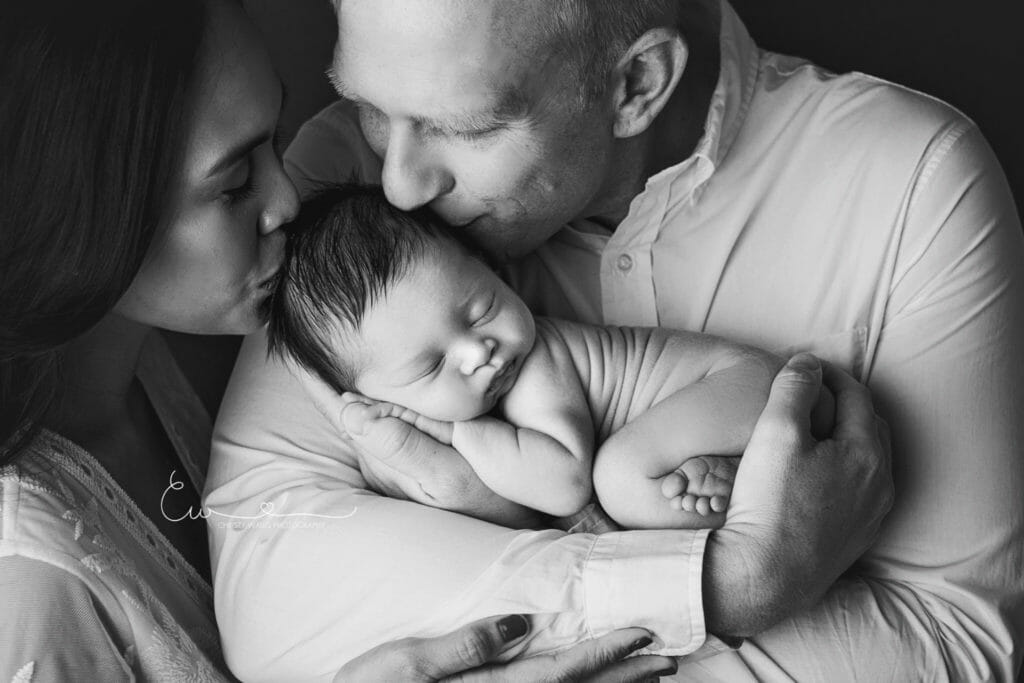 Best San Diego Newborn Photographer cute Newborn baby swaddled in soft blanket