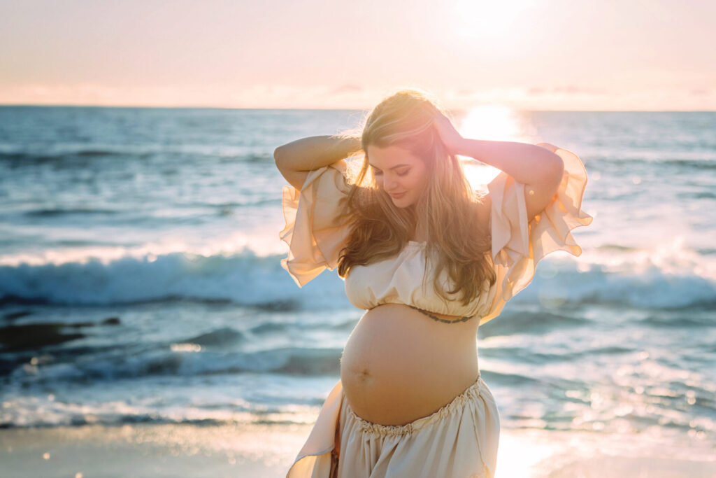 Sunset maternity portrait at the beach