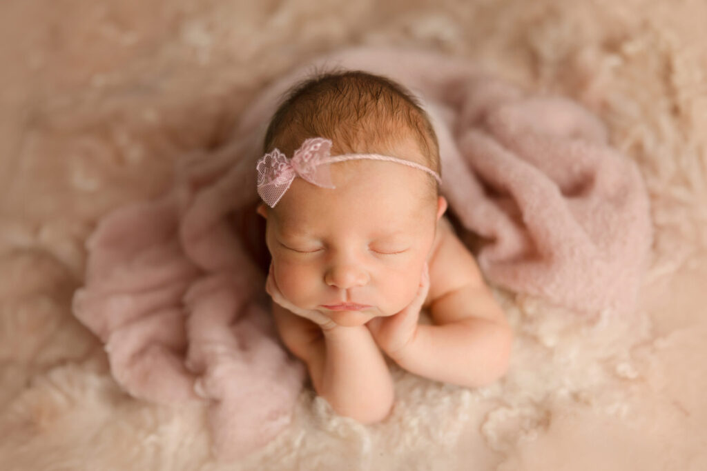 Newborn baby wrapped and sleeping