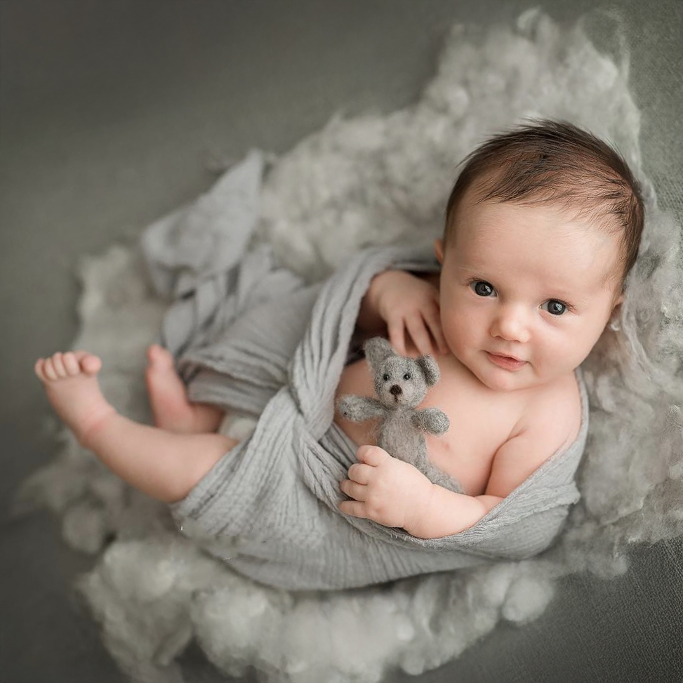 Best San Diego newborn photographer — cuddled newborn portrait